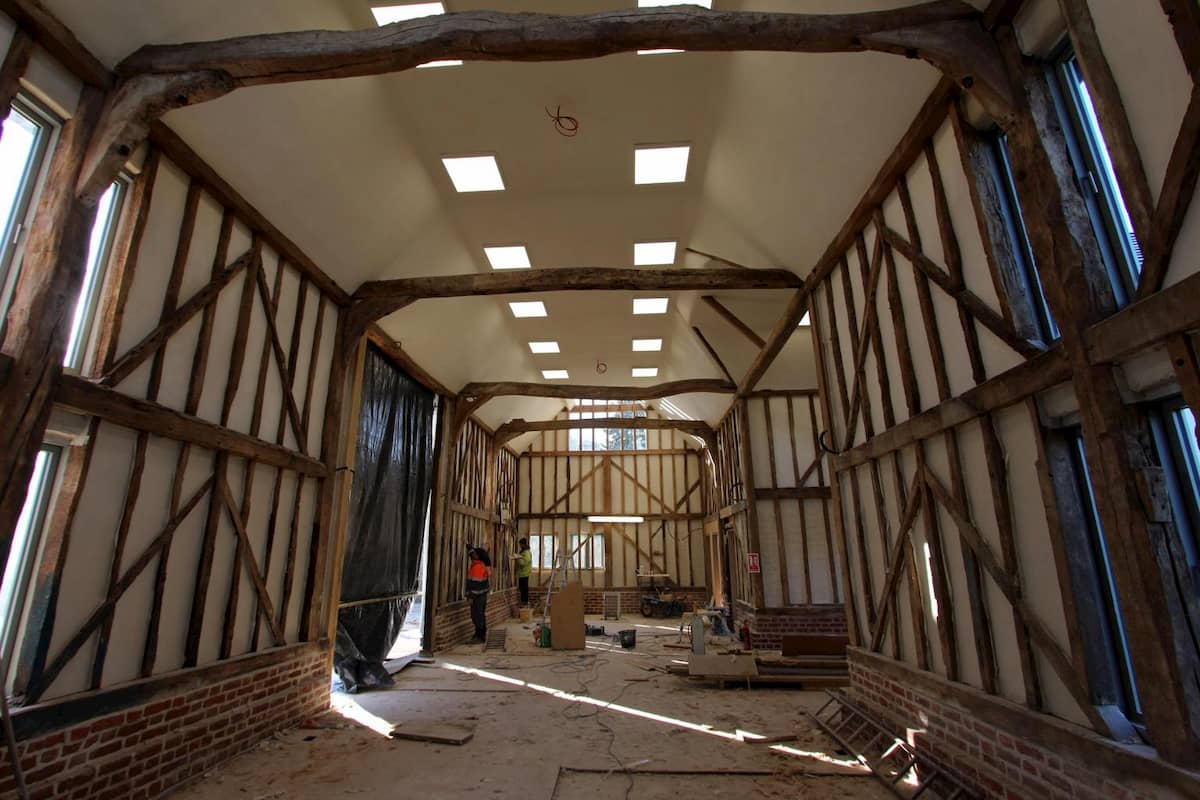 Timber framed barn with traditional lime plaster